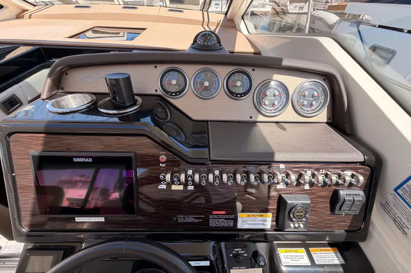 Slide: The Image of Control panel of a 2018 Sea Ray Sundancer 350 Coupe with gauges and navigation system. - 36