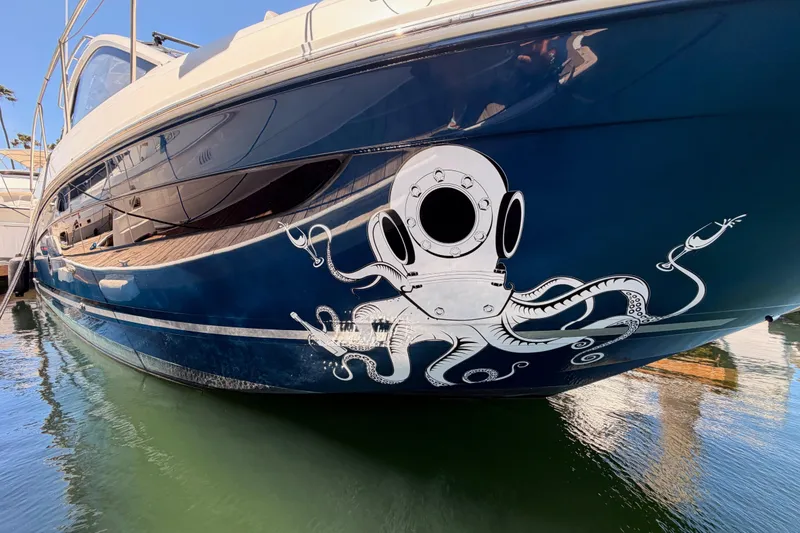 Slide: The Image of 2018 Sea Ray Sundancer 350 Coupe with octopus diver helmet graphic on hull. - 4