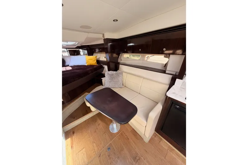 Slide: The Image of Interior of 2018 Sea Ray Sundancer 350 Coupe with cozy seating and elegant wood finishes. - 47
