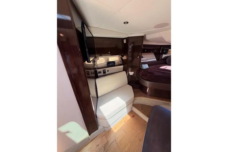 Slide: The Image of Interior of 2018 Sea Ray Sundancer 350 Coupe with seating and cozy cabin space. - 48