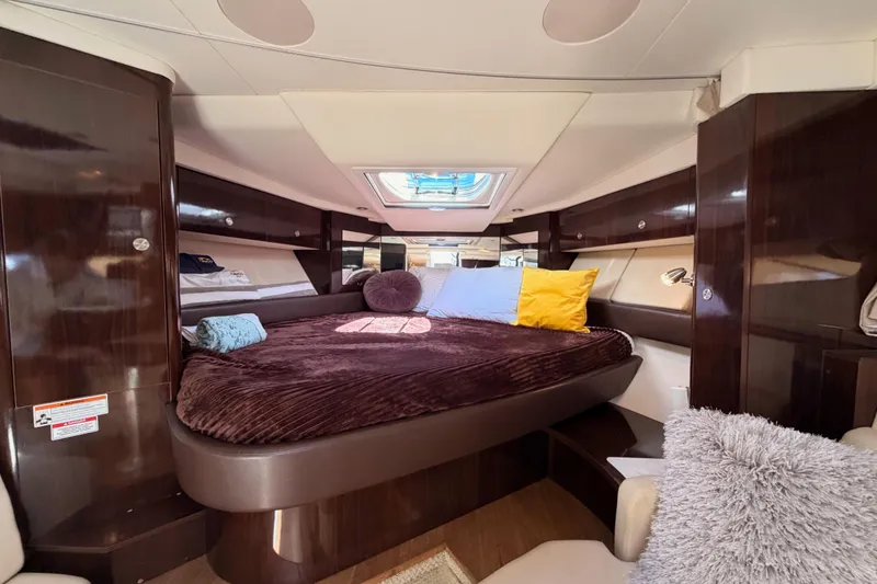 Slide: The Image of Luxurious cabin interior of 2018 Sea Ray Sundancer 350 Coupe yacht with plush bedding. - 50