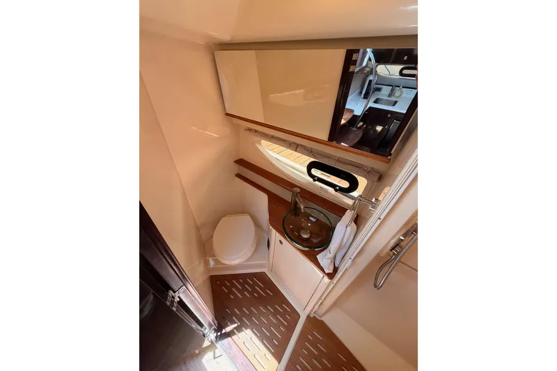 Slide: The Image of Interior of 2018 Sea Ray Sundancer 350 Coupe bathroom with modern fixtures. - 56