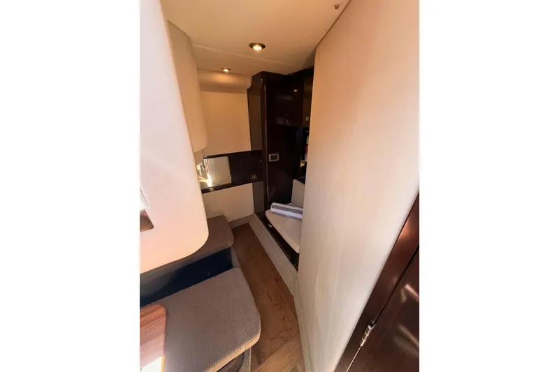 Slide: The Image of Interior of 2018 Sea Ray Sundancer 350 Coupe, featuring cozy seating and modern design. - 58