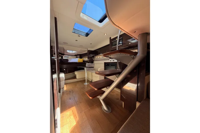Slide: The Image of Interior of 2018 Sea Ray Sundancer 350 Coupe with wooden flooring and modern design. - 67