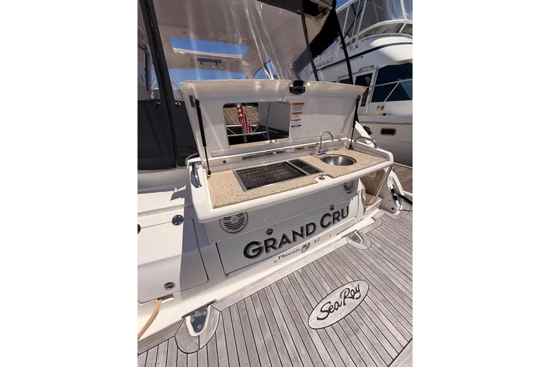 Slide: The Image of 2018 Sea Ray Sundancer 350 Coupe with outdoor kitchenette and "Grand Cru" nameplate. - 8