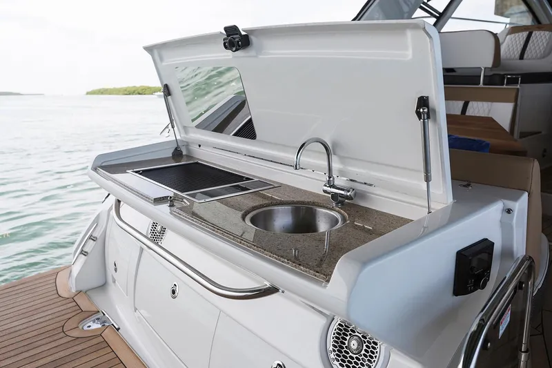 Slide: The Image of Manufacturer Provided Image: 2018 Sea Ray Sundancer 350 Coupe outdoor kitchen with sink and grill. - 9