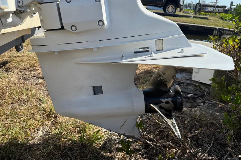 Slide: The Image of Close-up of a 1995 Scout 172 Sportfish boat propeller on grass. - 12