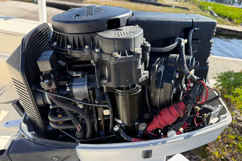 Slide: The Image of 1995 Scout 172 Sportfish boat engine with visible components and wiring. - 13