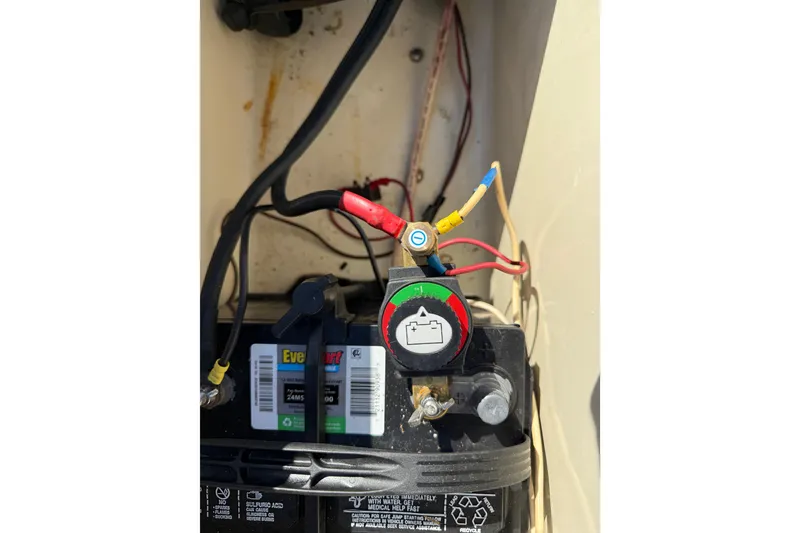 Slide: The Image of Battery setup in a 1995 Scout 172 Sportfish boat, featuring wiring and connections. - 20