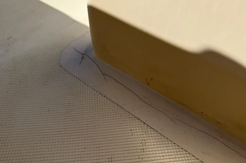 Slide: The Image of Crack on 1995 Scout 172 Sportfish boat deck near base of structure. - 22