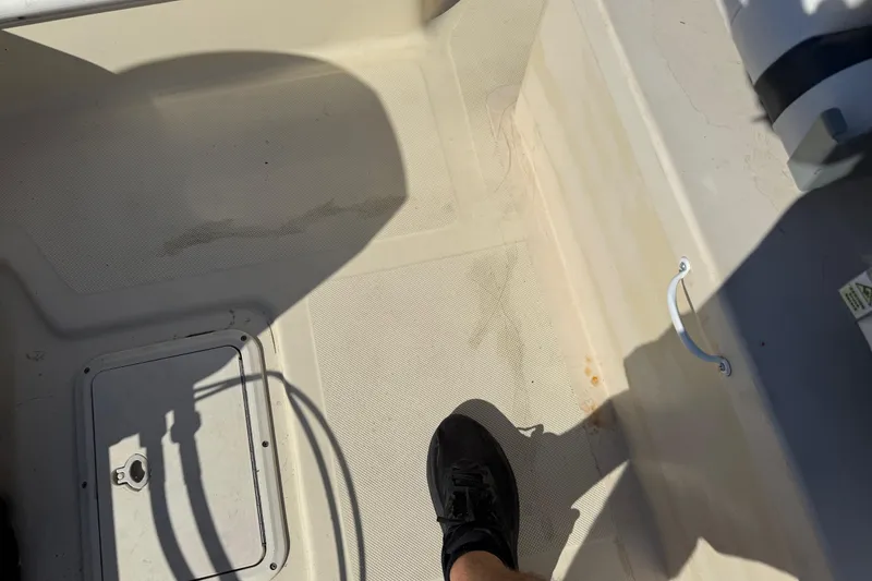 Slide: The Image of Interior view of a 1995 Scout 172 Sportfish boat, showing deck and foot. - 23