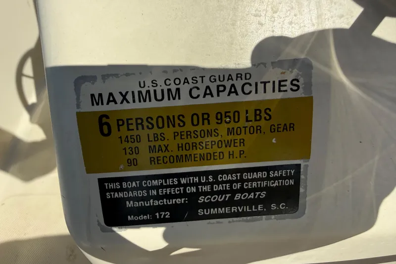 Slide: The Image of Scout 172 Sportfish 1995 capacity label: 6 persons, 950 lbs, 130 max horsepower. - 26