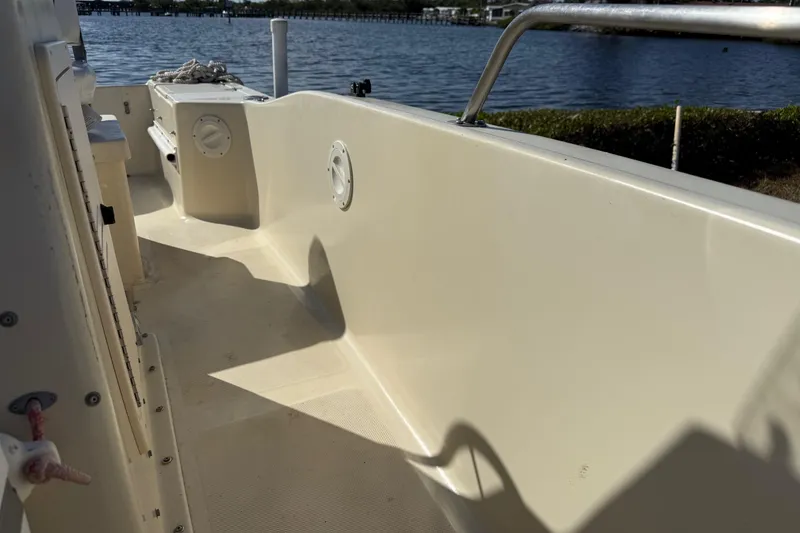 Slide: The Image of 1995 Scout 172 Sportfish boat interior with water view in the background. - 31