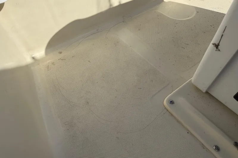 Slide: The Image of Close-up of 1995 Scout 172 Sportfish boat deck with textured surface. - 34