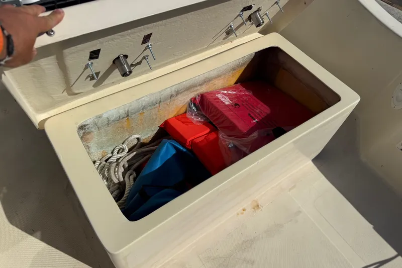 Slide: The Image of Open storage compartment on 1995 Scout 172 Sportfish boat with ropes and life jackets. - 39