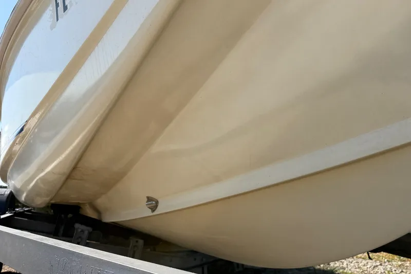Slide: The Image of 1995 Scout 172 Sportfish boat hull on trailer, close-up view. - 7