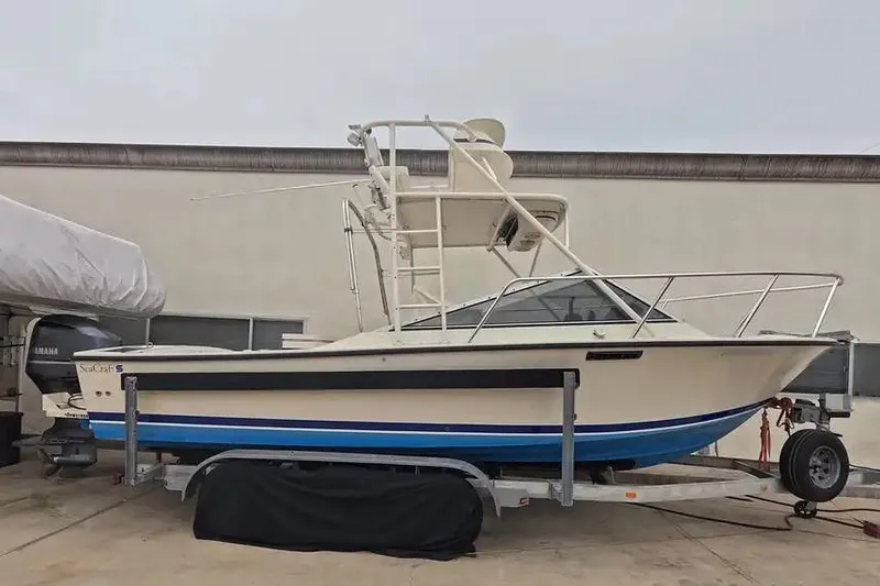 The Image of 1978 SeaCraft SC 21 Open boat on trailer, featuring a Yamaha outboard motor. - 1