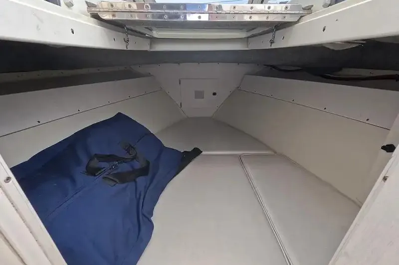 Slide: The Image of Interior cabin of a 1978 SeaCraft SC 21 Open boat with blue bag. - 12