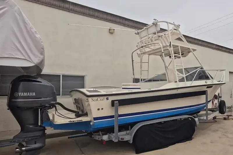 Slide: The Image of 1978 SeaCraft SC 21 Open boat with Yamaha motor on trailer, parked outdoors. - 4