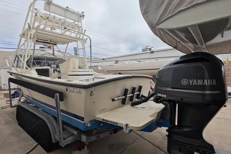 Slide: The Image of 1978 SeaCraft SC 21 Open boat with Yamaha outboard motor, parked on a trailer. - 7