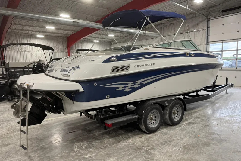 Slide: The Image of 2003 Crownline 270 BR boat on trailer in indoor storage facility. - 3