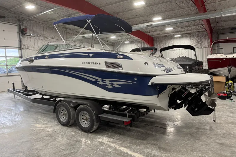 Slide: The Image of 2003 Crownline 270 BR boat on trailer in indoor storage facility. - 4
