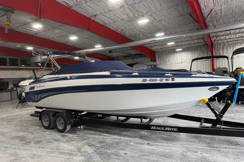 Slide: The Image of 2003 Crownline 270 BR boat on trailer in indoor storage facility. - 5