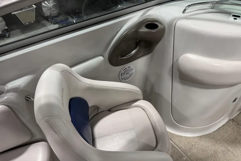 Slide: The Image of Interior of 2003 Crownline 270 BR boat with white seating and speaker. - 8
