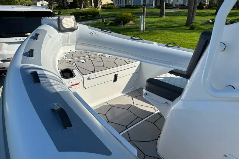 Slide: The Image of 2024 Highfield Sport 660 boat interior with modern seating and storage compartments. - 8