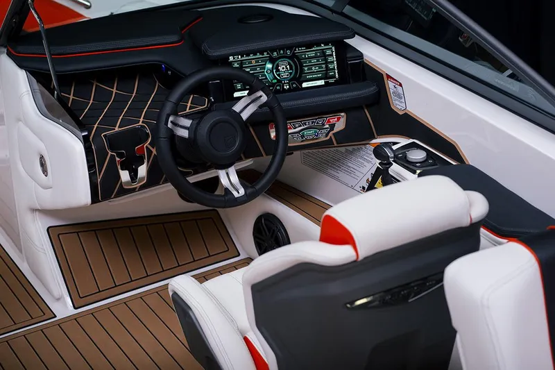 Slide: The Image of Manufacturer Provided Image: 2020 Nautique Super Air Nautique 210 boat interior with modern dashboard and steering wheel. - 10