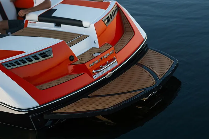 Slide: The Image of Manufacturer Provided Image: 2020 Nautique Super Air Nautique 210 boat rear deck on water. - 12