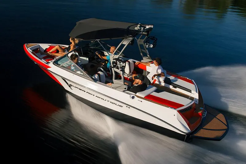 Slide: The Image of Manufacturer Provided Image: 2020 Nautique Super Air Nautique 210 speedboat cruising on water with passengers. - 7