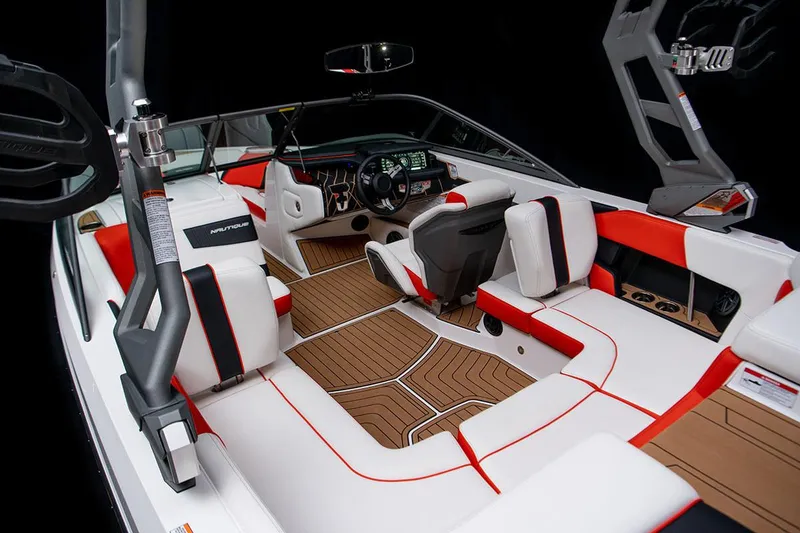 Slide: The Image of Manufacturer Provided Image: 2020 Nautique Super Air Nautique 210 interior with white and red seating, advanced dashboard. - 9