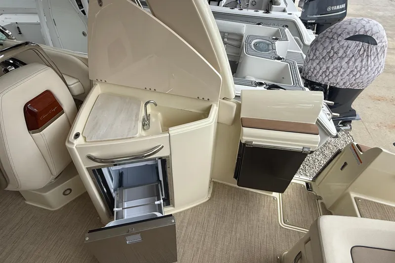 Slide: The Image of 2024 Chris-Craft Launch 28 GT interior with luxurious seating and helm. - 11