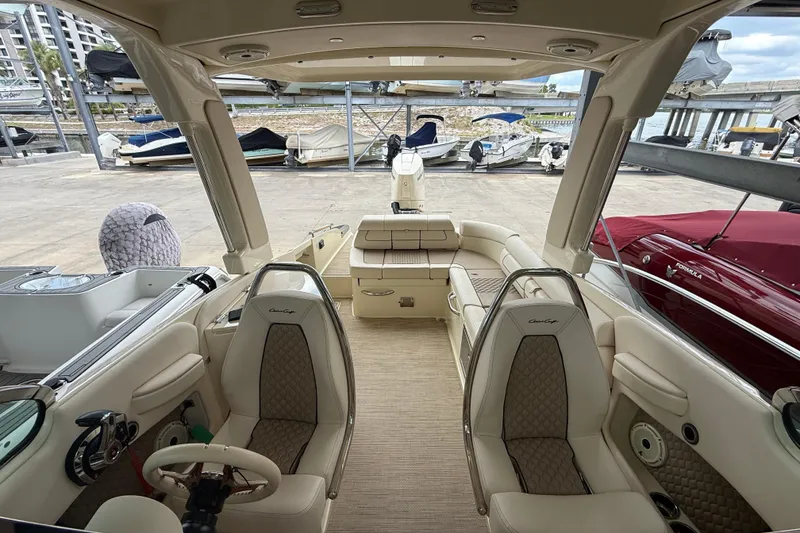 Slide: The Image of 2024 Chris-Craft Launch 28 GT interior with beige seating and sleek dashboard design. - 17