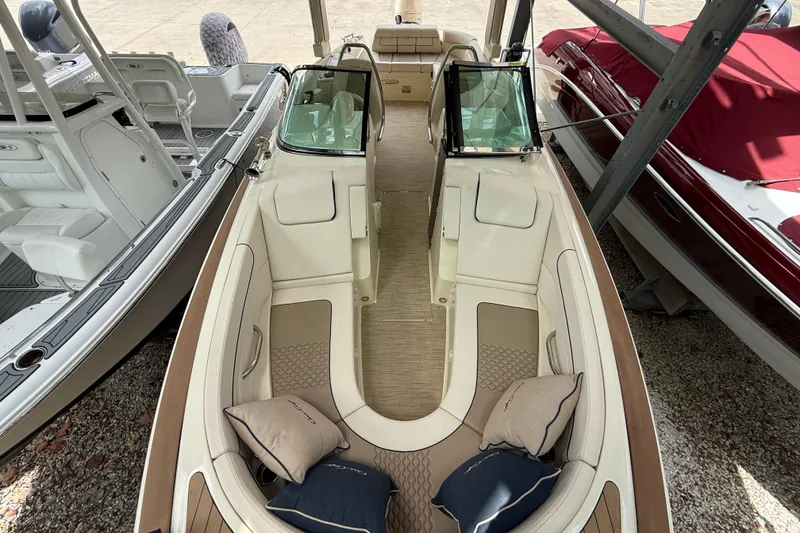 Slide: The Image of 2024 Chris-Craft Launch 28 GT boat interior with luxurious seating and cushions. - 24