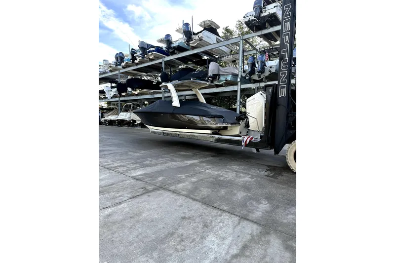 Slide: The Image of 2024 Chris-Craft Launch 28 GT boat stored on a rack in a marina. - 29