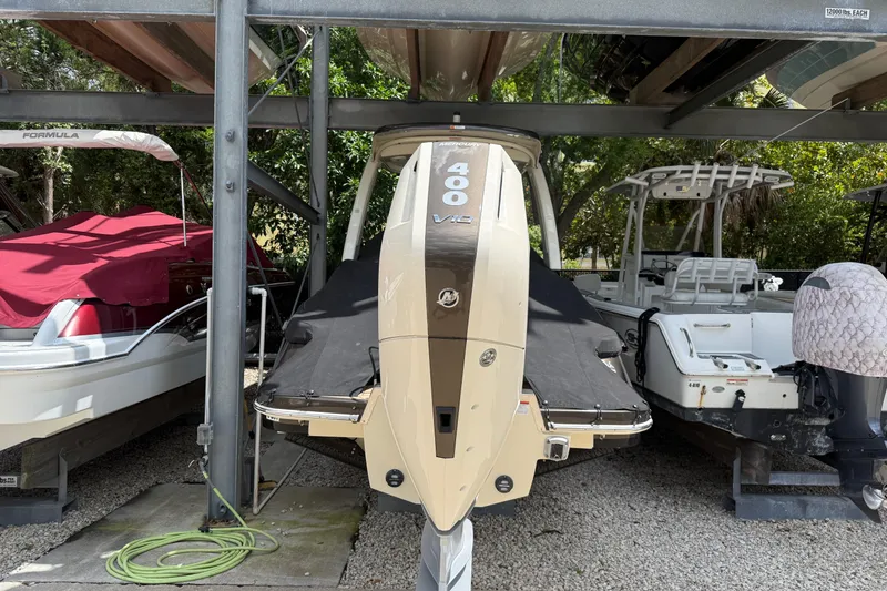 Slide: The Image of 2024 Chris-Craft Launch 28 GT boat docked, featuring sleek design and luxurious seating. - 4