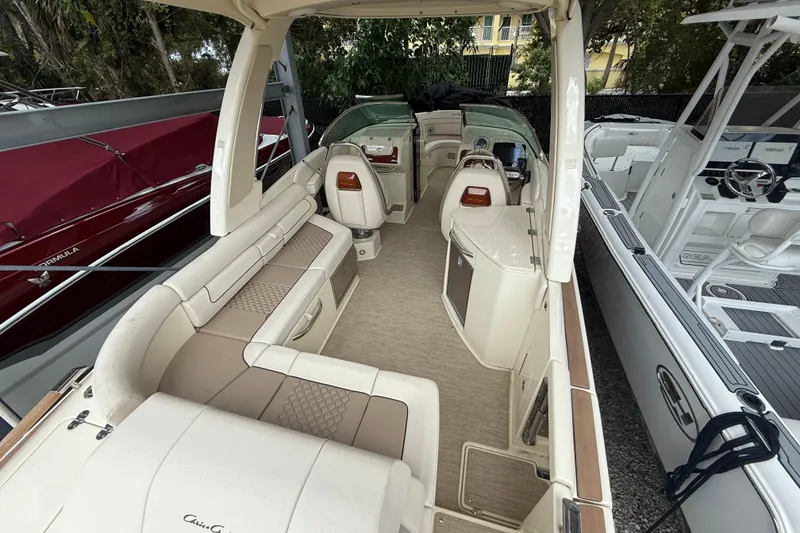 Slide: The Image of 2024 Chris-Craft Launch 28 GT docked at marina, rear view. - 6