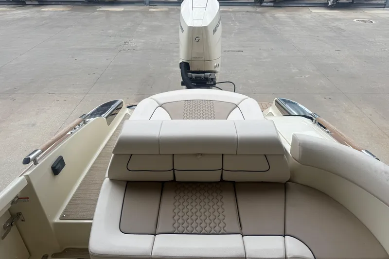 Slide: The Image of 2024 Chris-Craft Launch 28 GT boat docked at marina, showcasing sleek design and luxury features. - 7