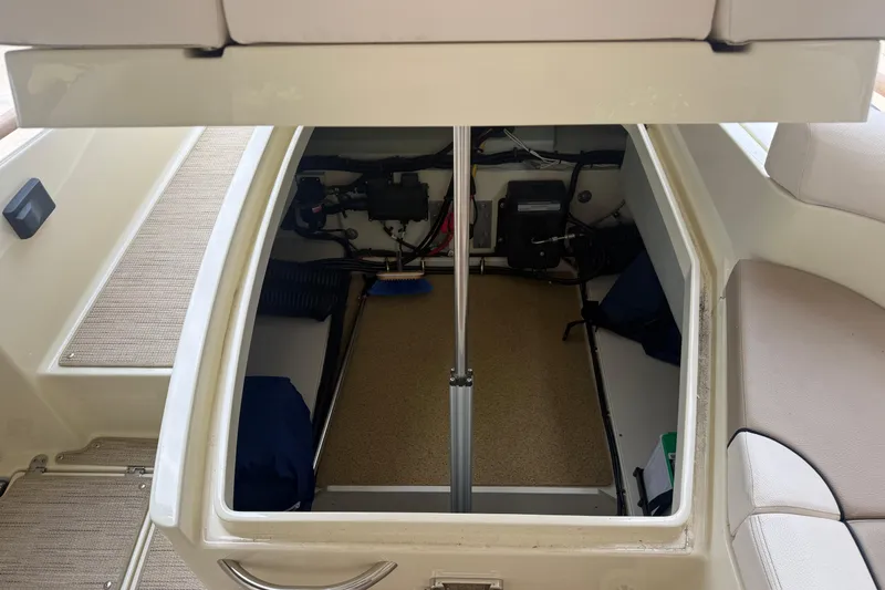 Slide: The Image of 2024 Chris-Craft Launch 28 GT boat with Mercury engine, covered and stored outdoors. - 8