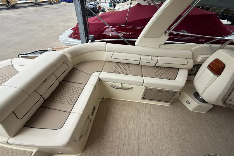 Slide: The Image of 2024 Chris-Craft Launch 28 GT boat in storage, rear view with cover. - 9