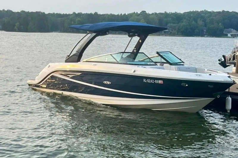The Image of 2022 Sea Ray SLX 280 boat docked on a serene lake. - 0