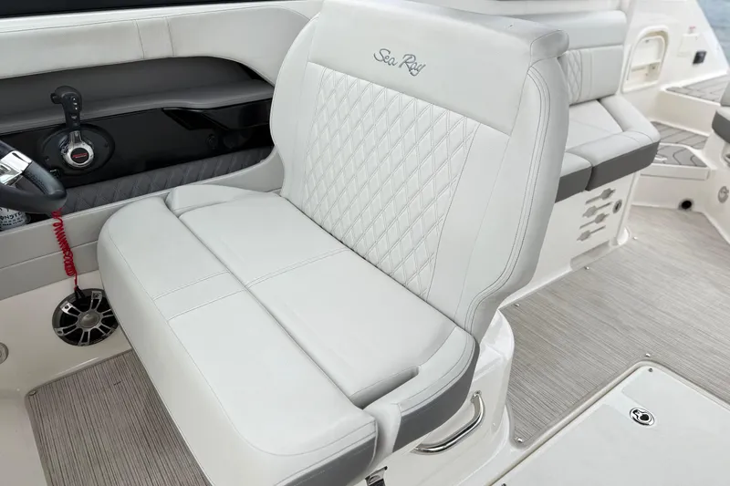 Slide: The Image of Luxurious interior of 2022 Sea Ray SLX 280 boat with plush seating and modern controls. - 14