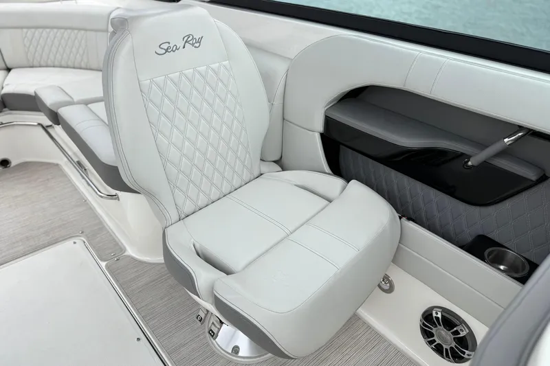 Slide: The Image of 2022 Sea Ray SLX 280 boat interior with luxurious white seating and elegant design. - 17