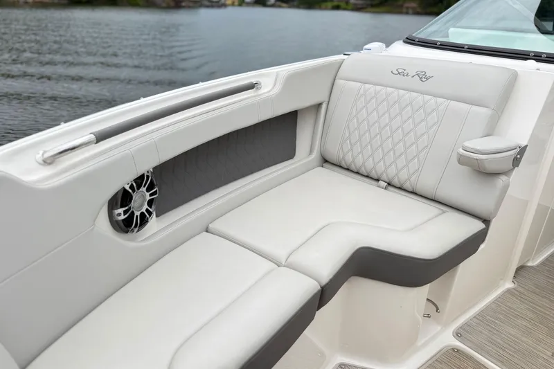 Slide: The Image of Luxurious seating on 2022 Sea Ray SLX 280 boat, featuring elegant upholstery and speaker detail. - 19