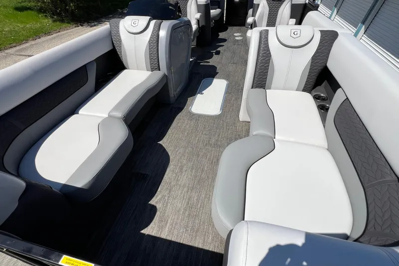 Slide: The Image of Luxurious seating on 2023 Godfrey Monaco 235 SB pontoon boat interior. - 13