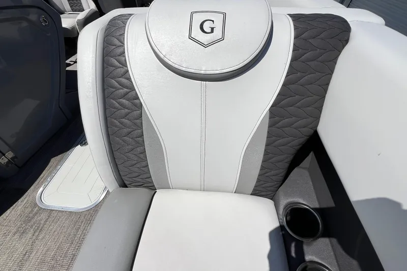 Slide: The Image of Luxurious seating on 2023 Godfrey Monaco 235 SB boat with elegant design and cup holders. - 14