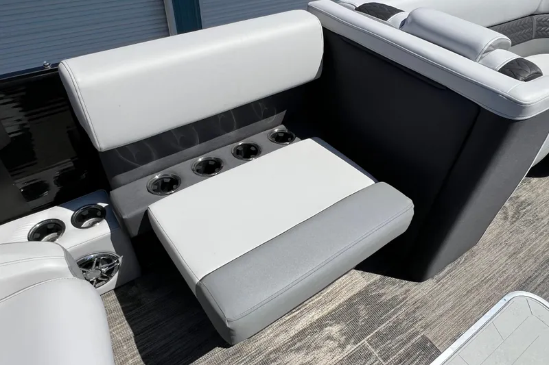 Slide: The Image of Luxurious seating on 2023 Godfrey Monaco 235 SB boat with integrated cup holders. - 18