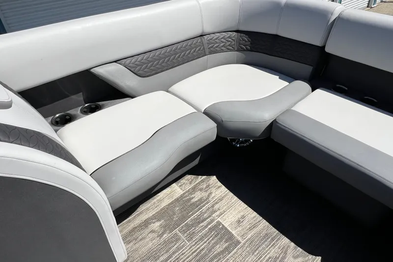Slide: The Image of 2023 Godfrey Monaco 235 SB boat interior with gray and white seating. - 20